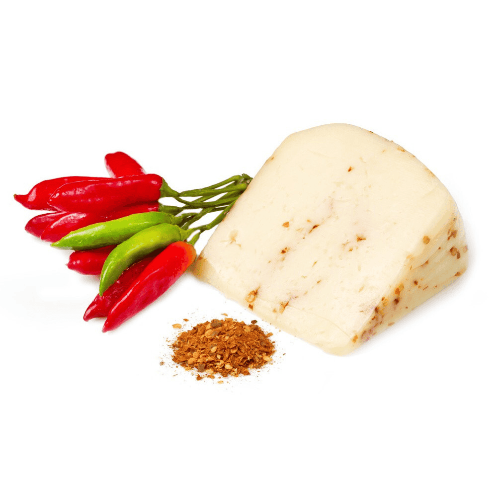 Block of pecorino cheese with red and green peppers and a spice on a white background