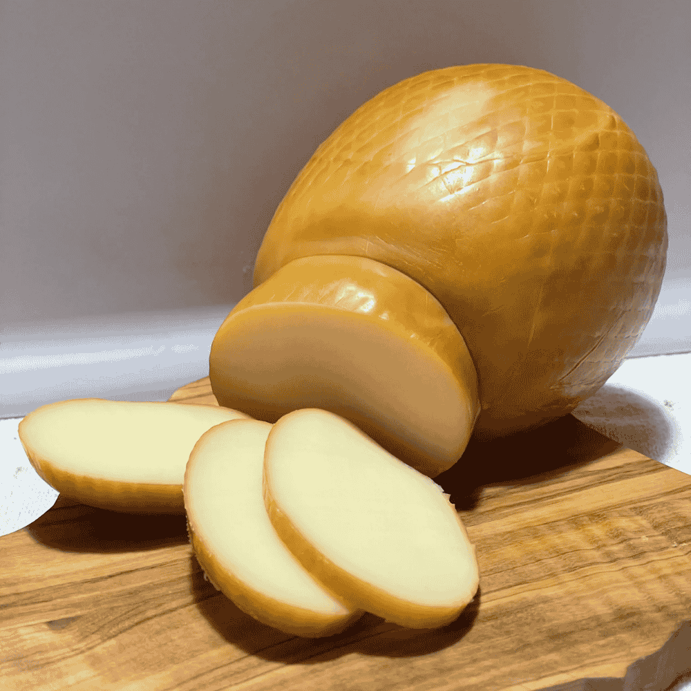 scamorza affumicata slices on a wooden board
